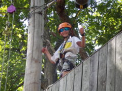 Young boy enjoying overnight summer camp at Camp Tall Timbers