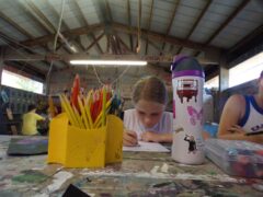 Camp Tall Timbers camper during an art class